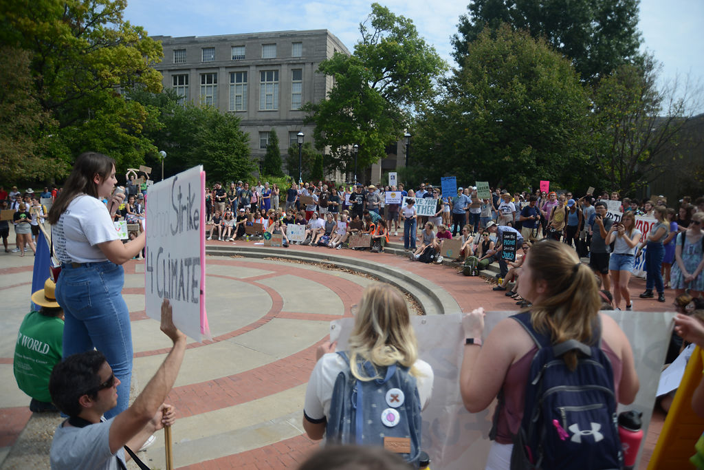 Sadie Jess speaks to protestors at the Climate March on Friday